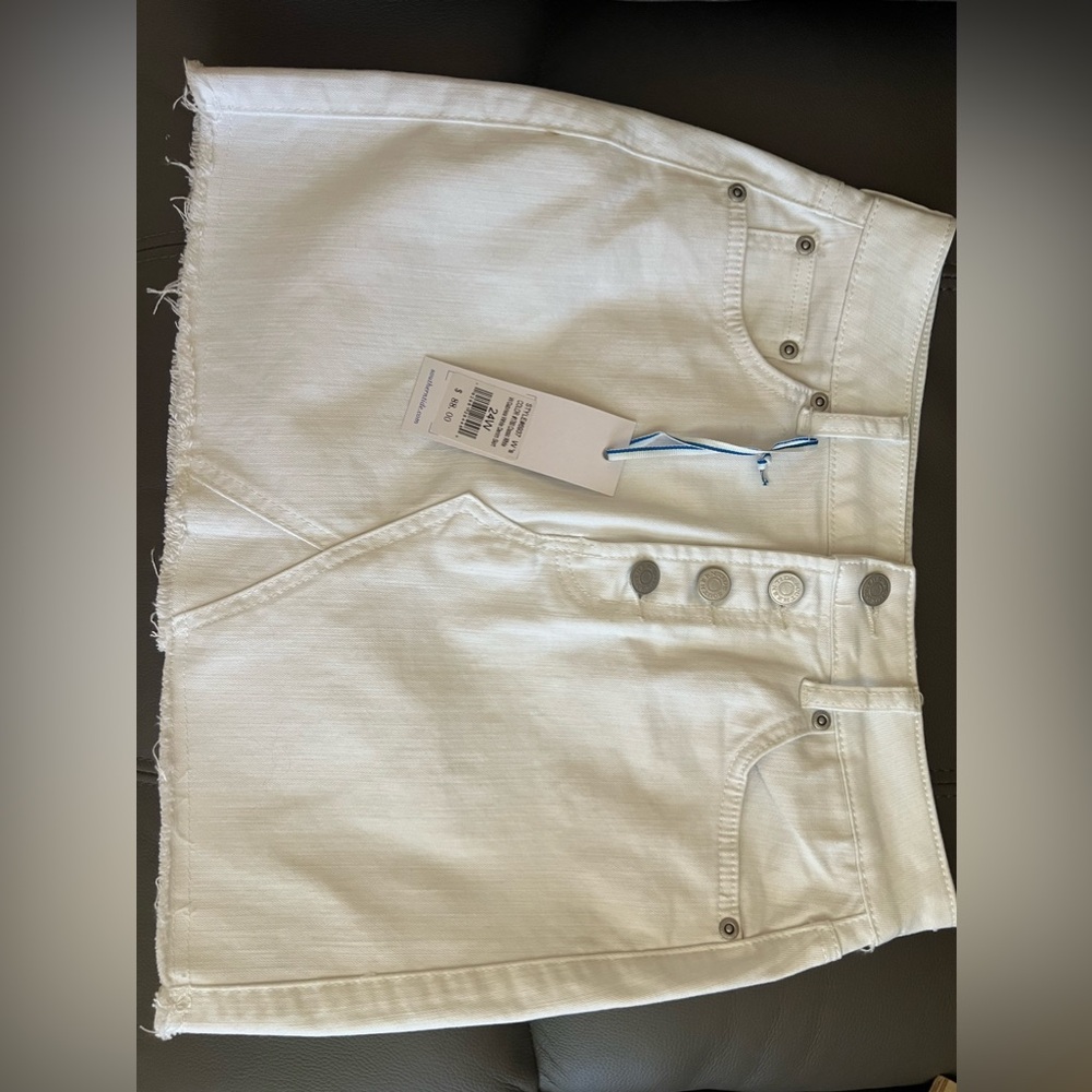 White denim mini skirt with button fly